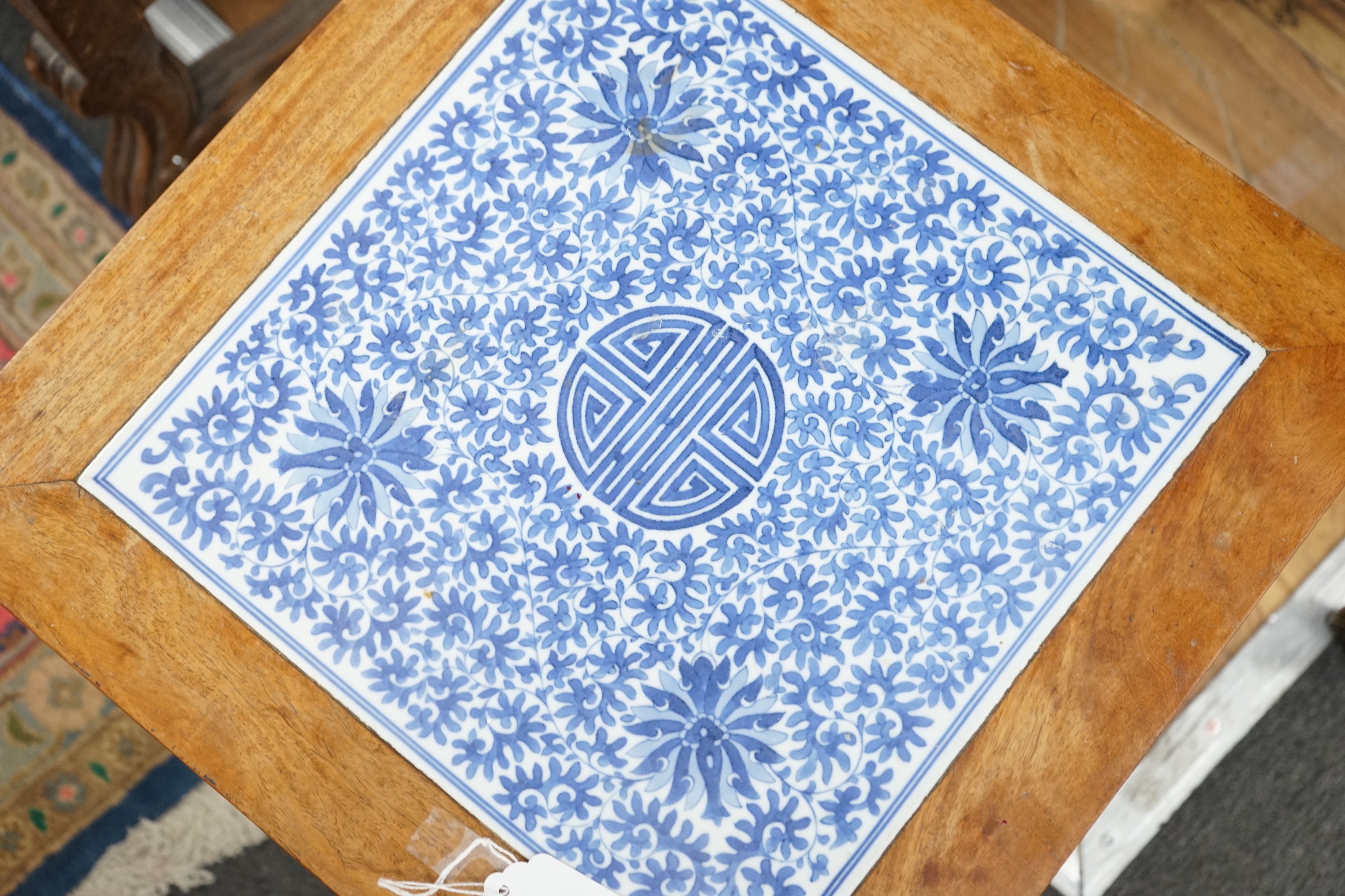 A Chinese hardwood and underglaze blue porcelain tile inset table, width 42cm, depth 42cm, height 43cm